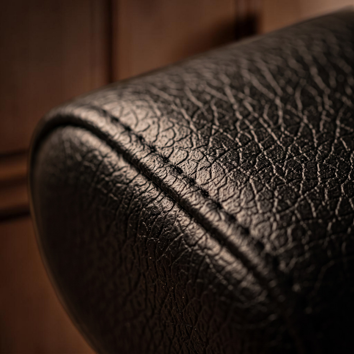Watch winder cushion in textured black finish with detailed stitching