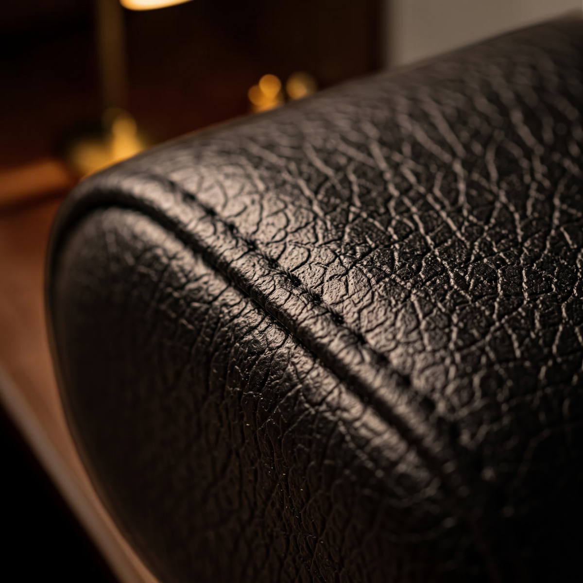 Watch winder cushion in grained black finish with stitching